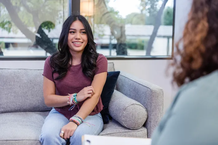 young woman talking to a therapist.